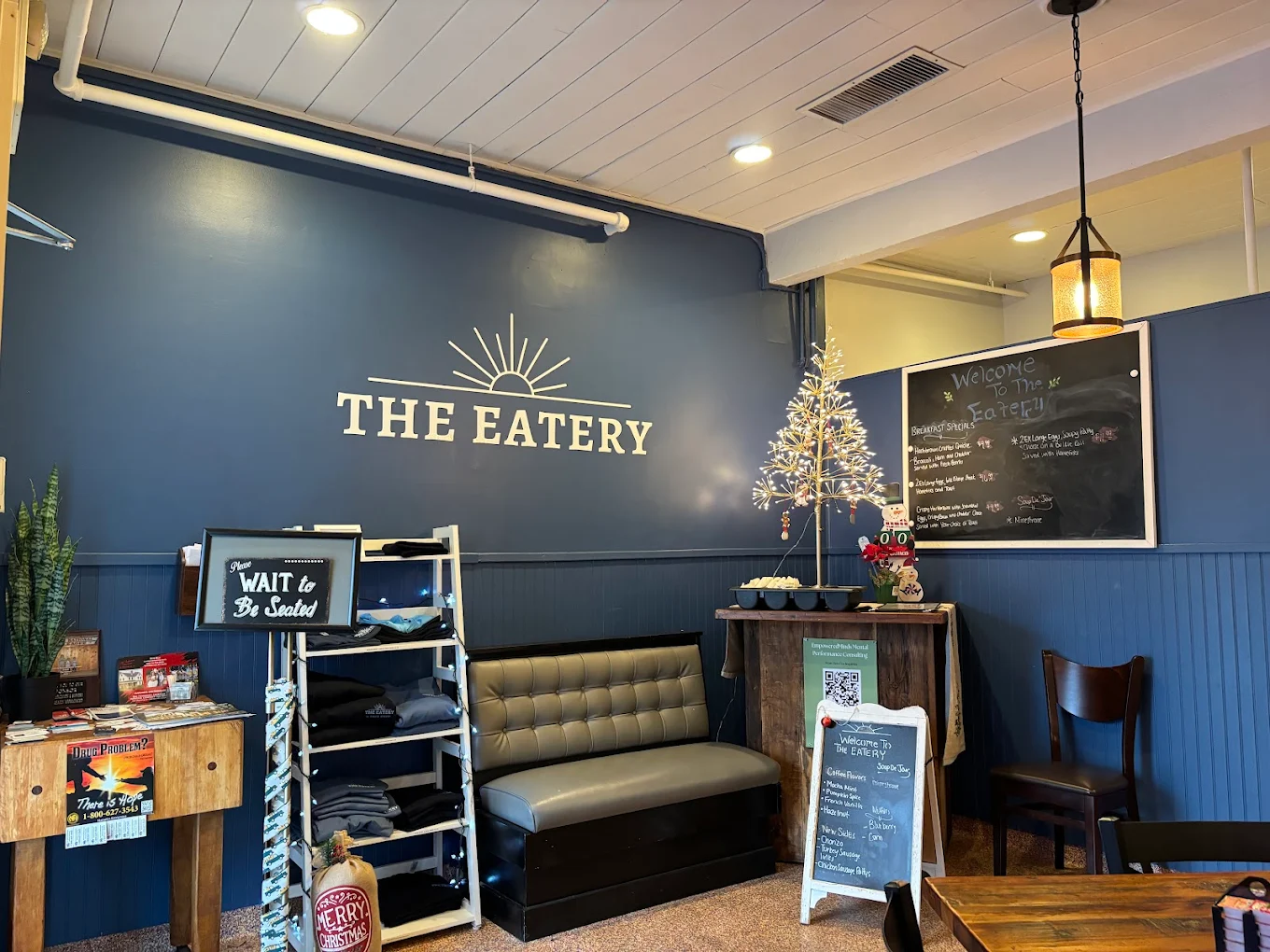 The Eatery's cozy interior with navy blue walls